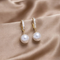 Elegant earrings with pearls and zirconia - White