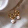 Elegant earrings with golden pearls